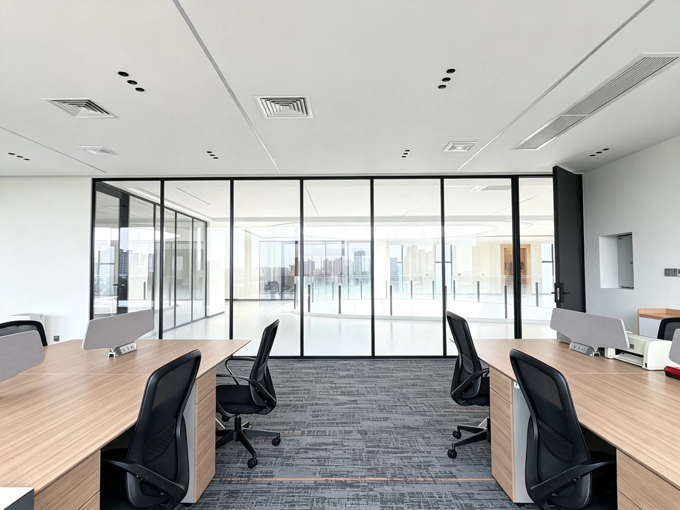 Modern office furniture with open workstations and glass partitions