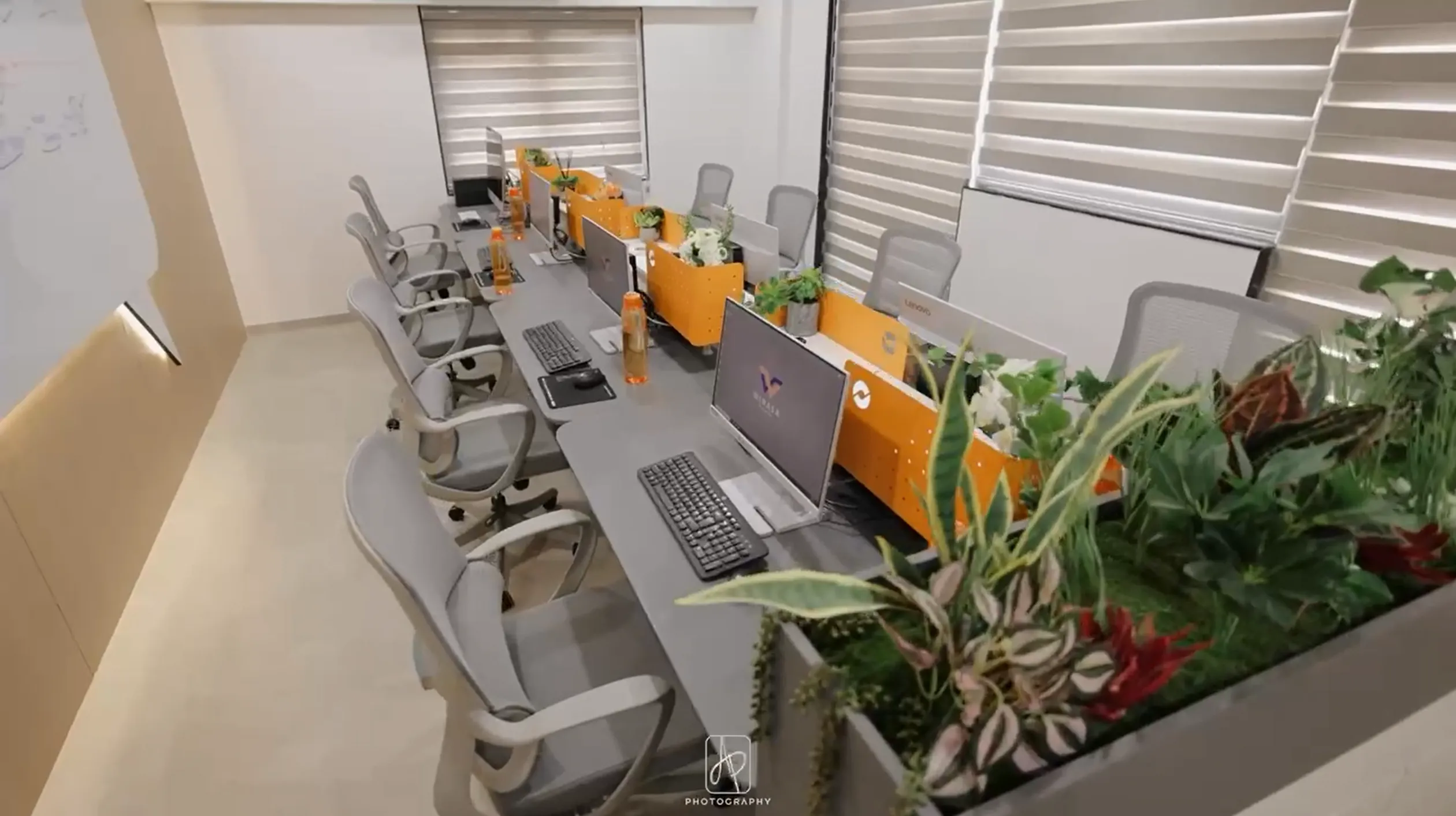 Open office workstations with ergonomic chairs at WINASA Ceramica