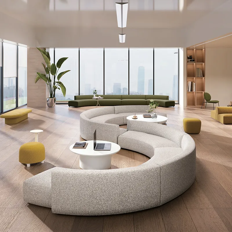 Collaborative office lounge seating with curved upholstered sofa modules