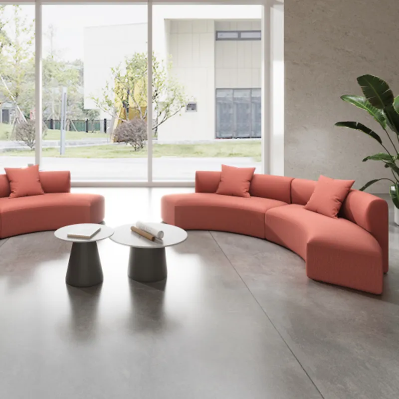 Curved office sofa creating an open seating area for modern shared workspaces