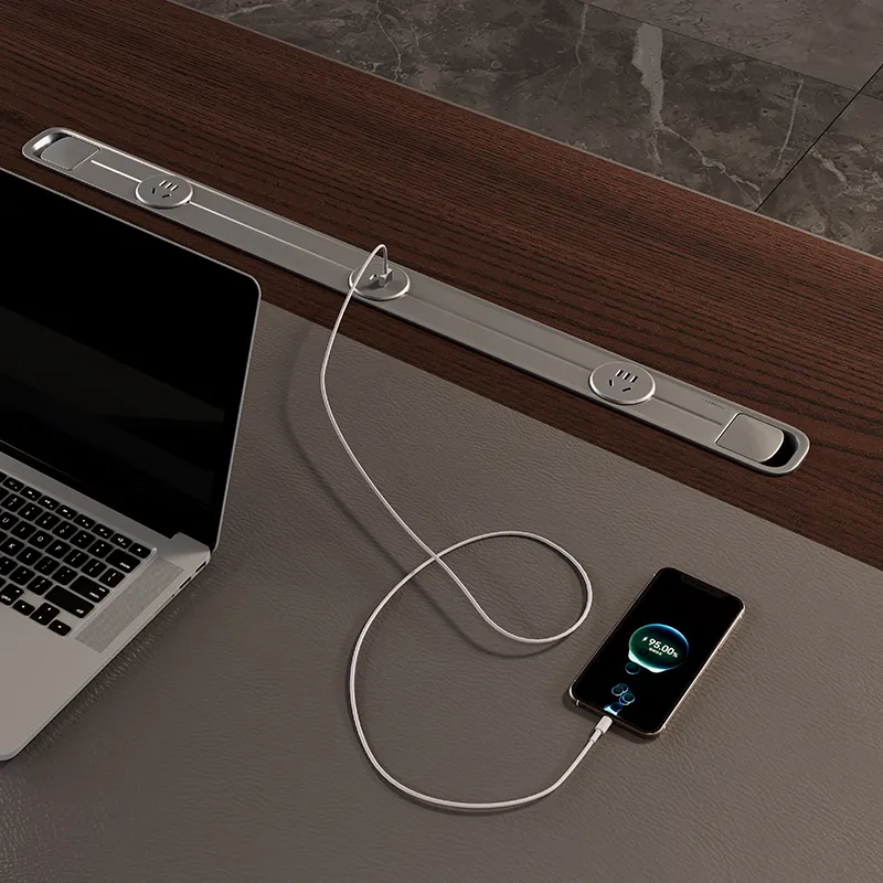 Integrated desktop power box on executive office desk for convenient device charging