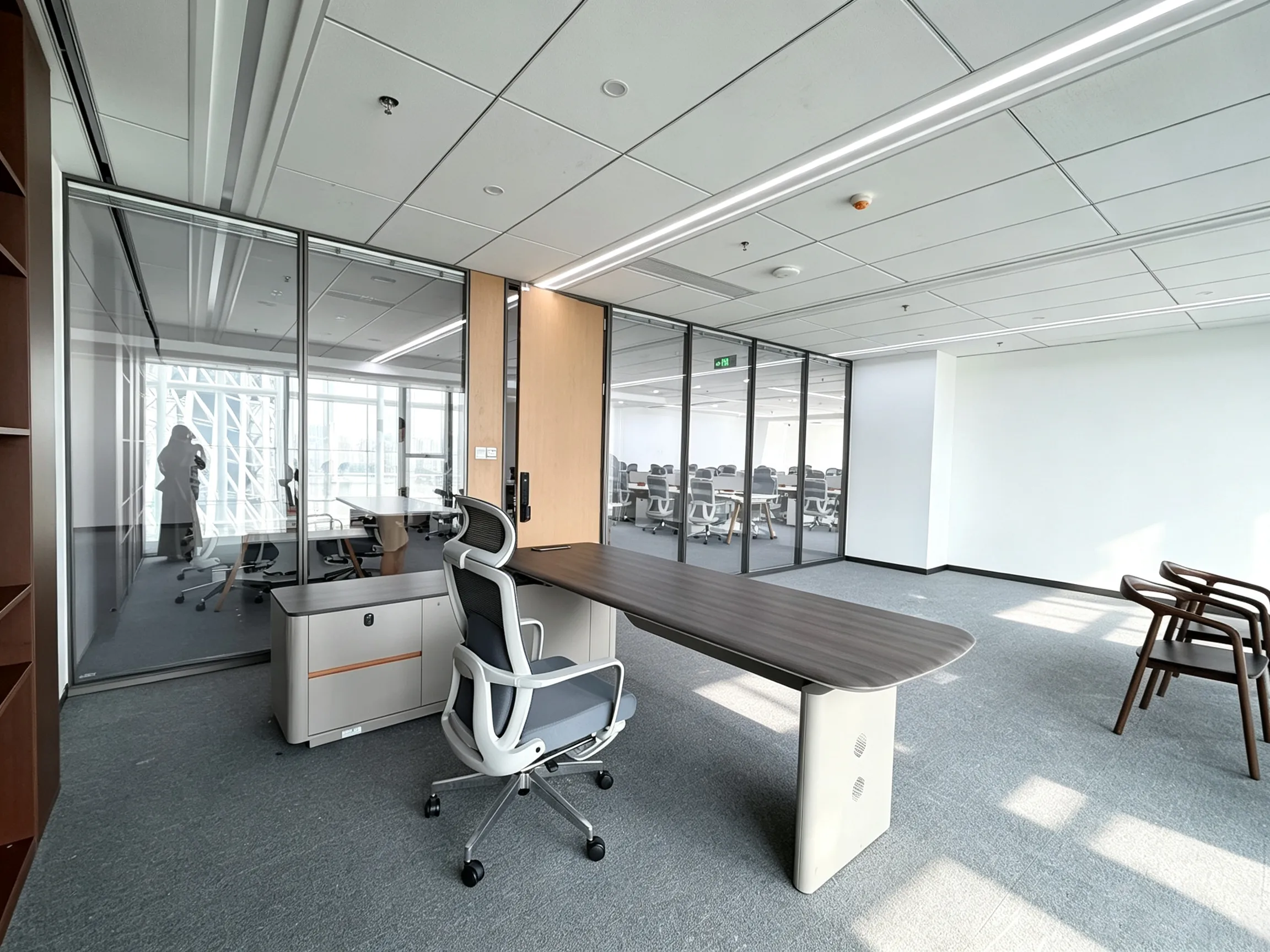 Modern executive office design with glass partition