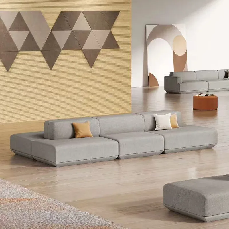 Linear modular office lounge sofa with wide upholstered seat and low-profile design