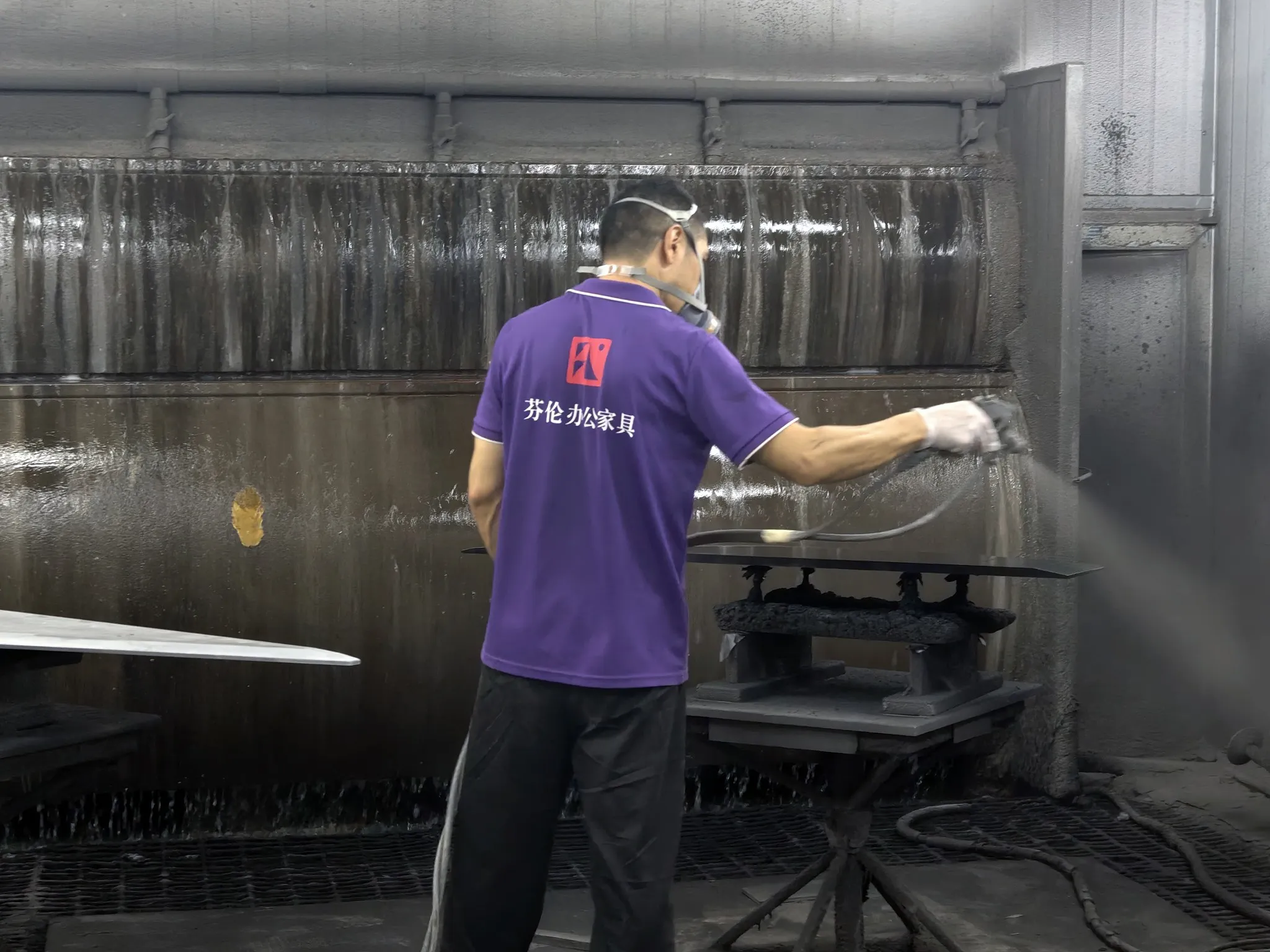 Spray painting workshop for office furniture components