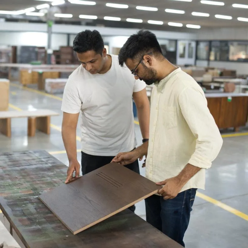 Woodworker Inspecting Walnut Panels